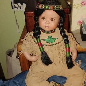 Beautiful sit up one position vintage doll with the most adorable profile